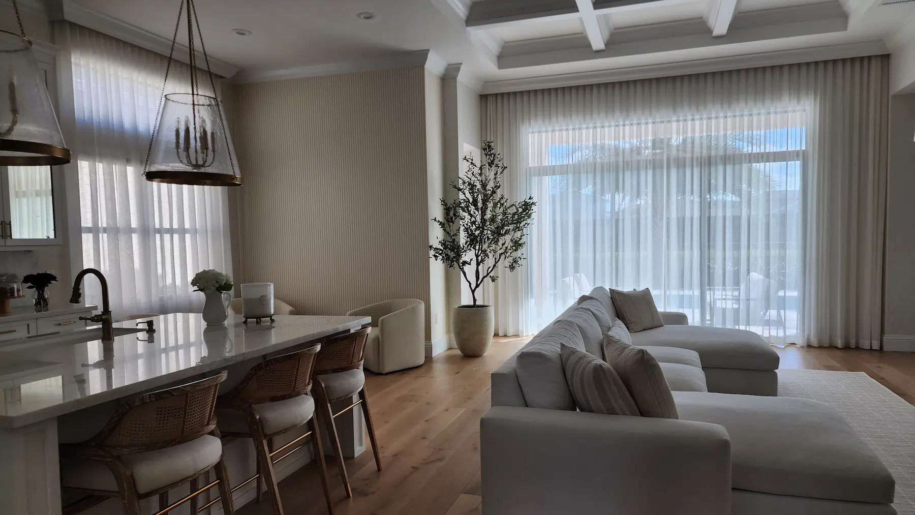 Cozy bedroom with custom blackout window shades, designed to provide enhanced privacy and promote restful sleep.