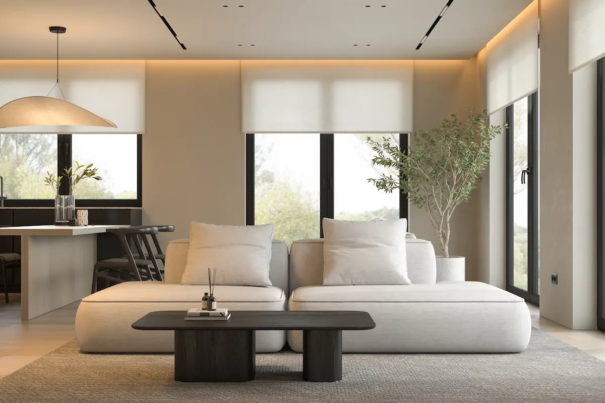 A living room with large windows featuring sleek motorized shades controlled via a smartphone app.